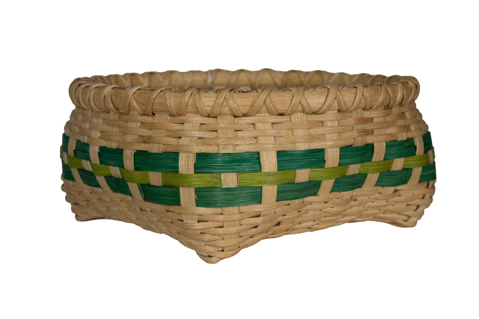 A hand-woven basket made of natural tan reed or straw, featuring a decorative horizontal band woven with dark green and light olive green strips, isolated on a white background.